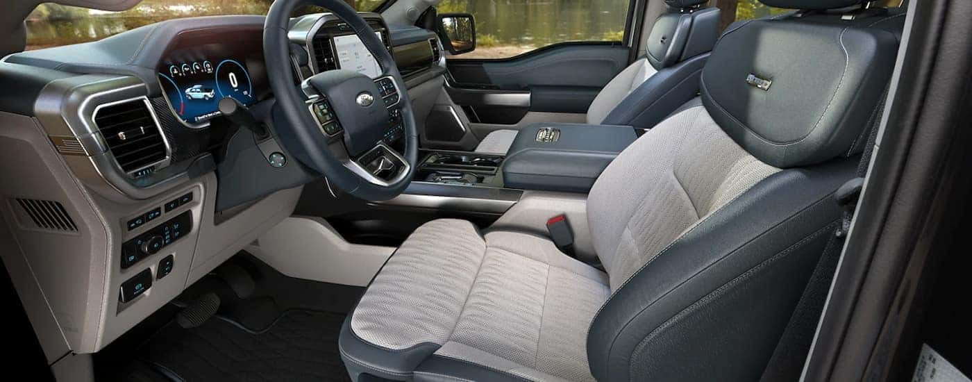 The black and grey 2023 Ford F-150 Limited is shown from the driver's side.