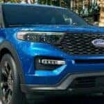 A popular Ford Explorer for sale, a 2023 Ford Explorer ST, is shown parked on a road.