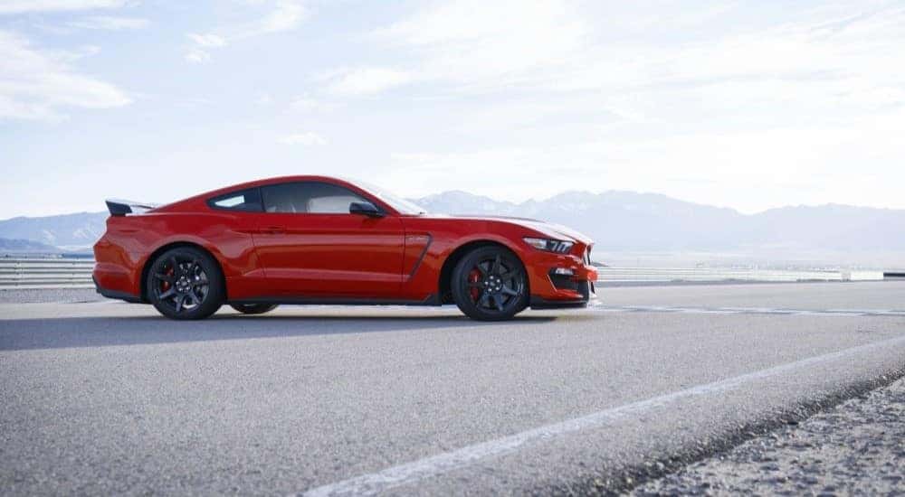 A red 2020 Ford Mustang GT350 is shown on a racetrack after leaving a Ford dealer near Westfield.
