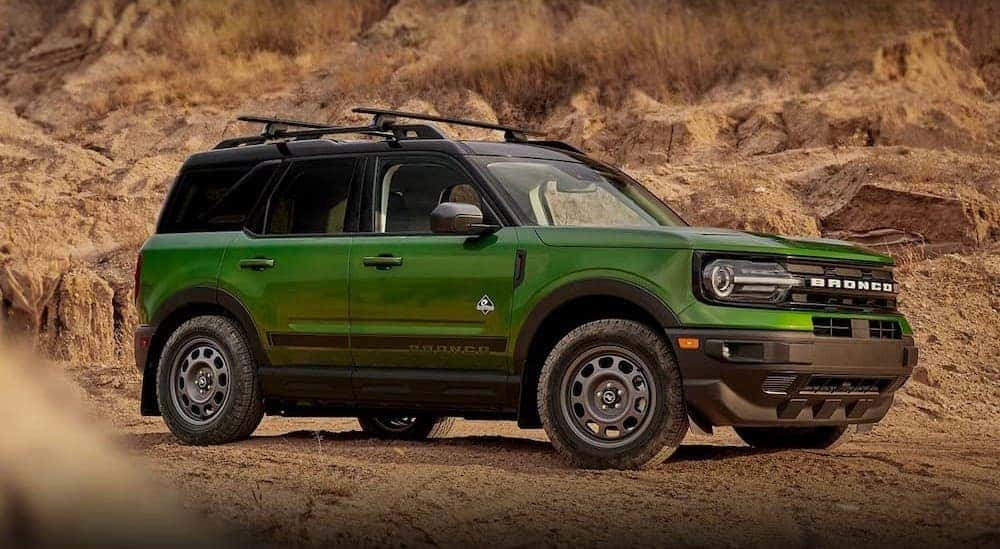A green 2023 Ford Bronco Sport Outer Banks is shown parked off-road after visiting a Ford dealer near Whitestown.