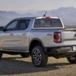 A silver 2024 Ford Ranger Lariat is shown from the rear at an angle.