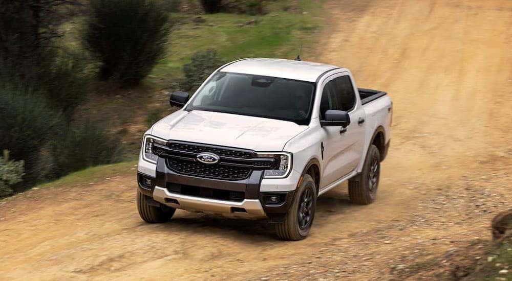 A white 2024 Ford Ranger XLT is shown from the front at an angle.