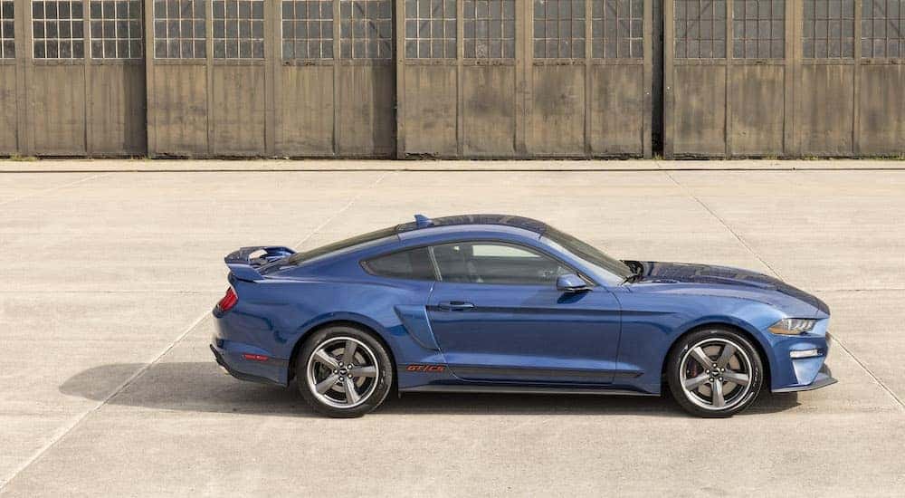 A blue 2022 Ford Mustang GT California Special is shown from the side.