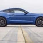 A blue 2022 Ford Mustang Ecoboost is shown from the side after leaving a used car dealer near Carmel.