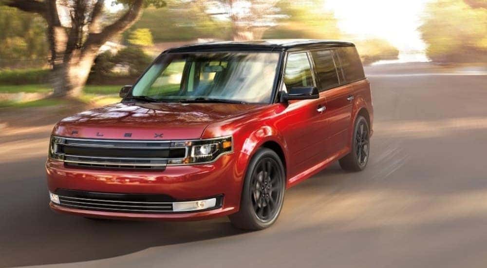 A red 2018 Ford Flex is shown driving.