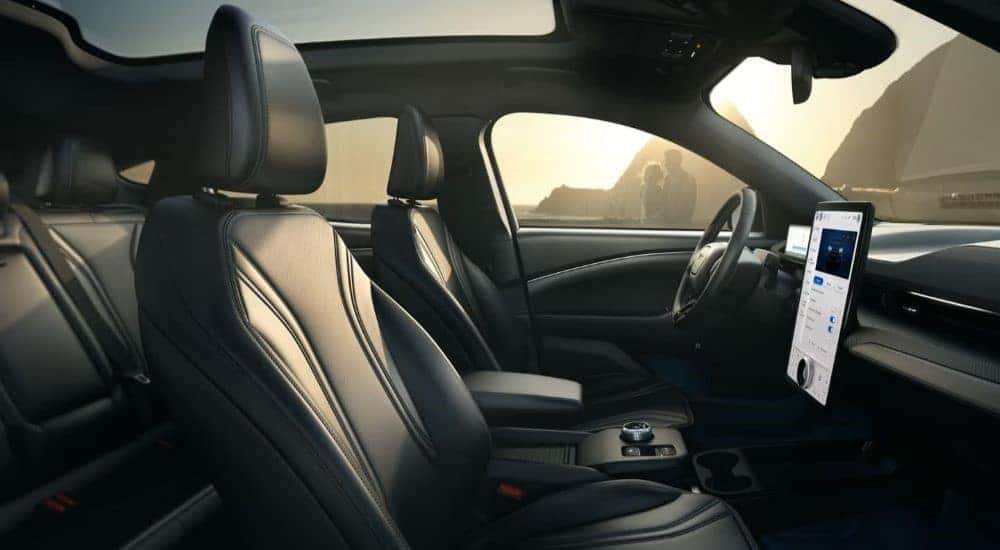 The black leather front seats and dash are shown in 2024 Ford Mustang Mach-E.