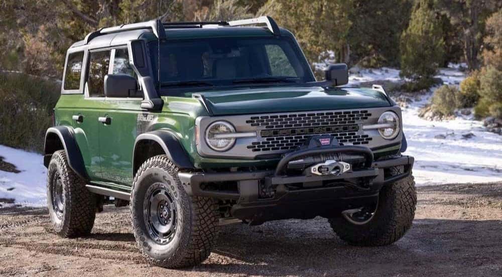 A green 2024 Ford Bronco Sport Everglades is shown parked off-road.