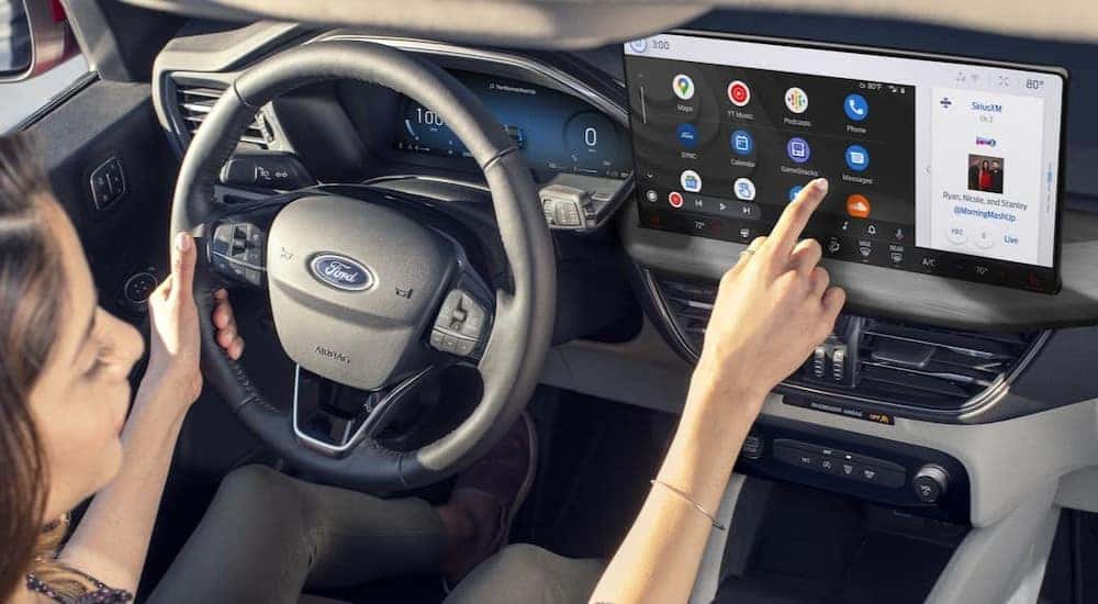 The gray dash and infotainment screen is shown in a 2024 Ford Escape.