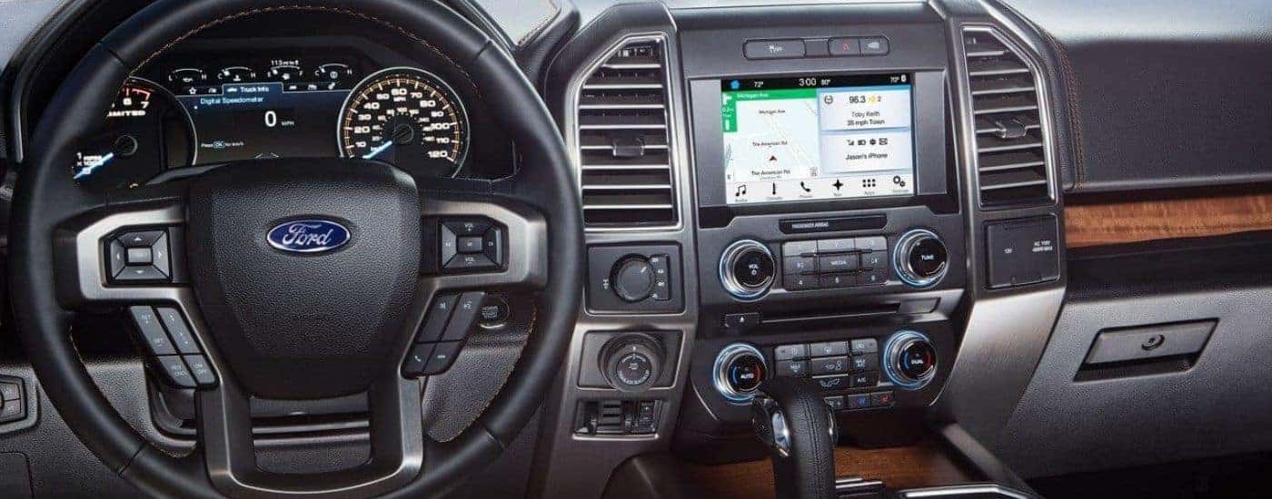 The black and brown interior is shown in a 2017 Ford F-150 Limited.