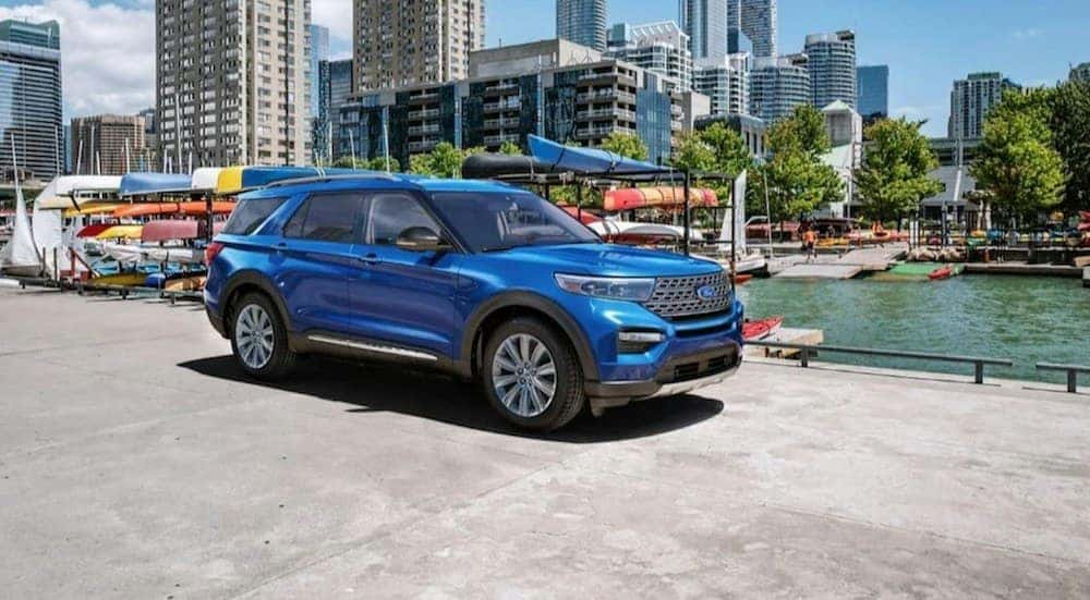 A blue 2023 Ford Explorer is shown from the side.