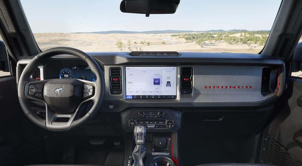 The steering wheel and dashboard in a 2025 Ford Bronco Big Bend with Free Wheeling Package at a Ford dealer near Frankfort.