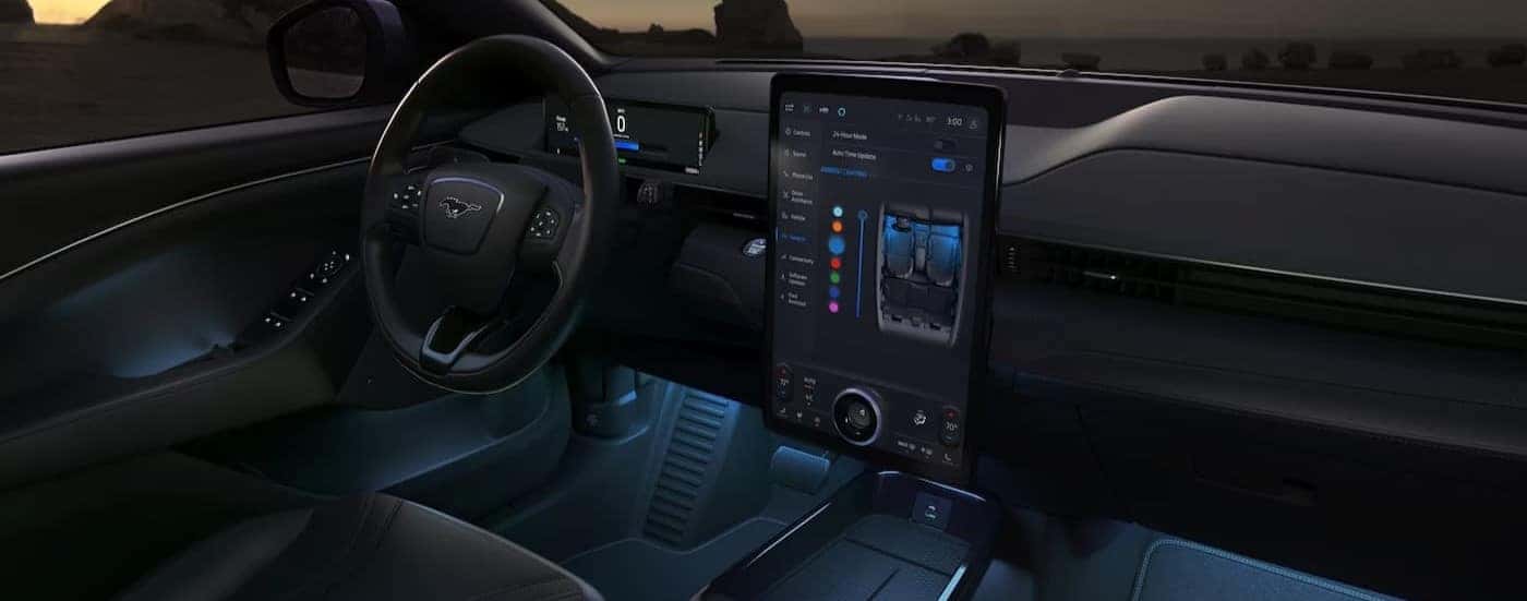 The black interior and dash are shown in a 2024 Ford Mustang Mach-E.
