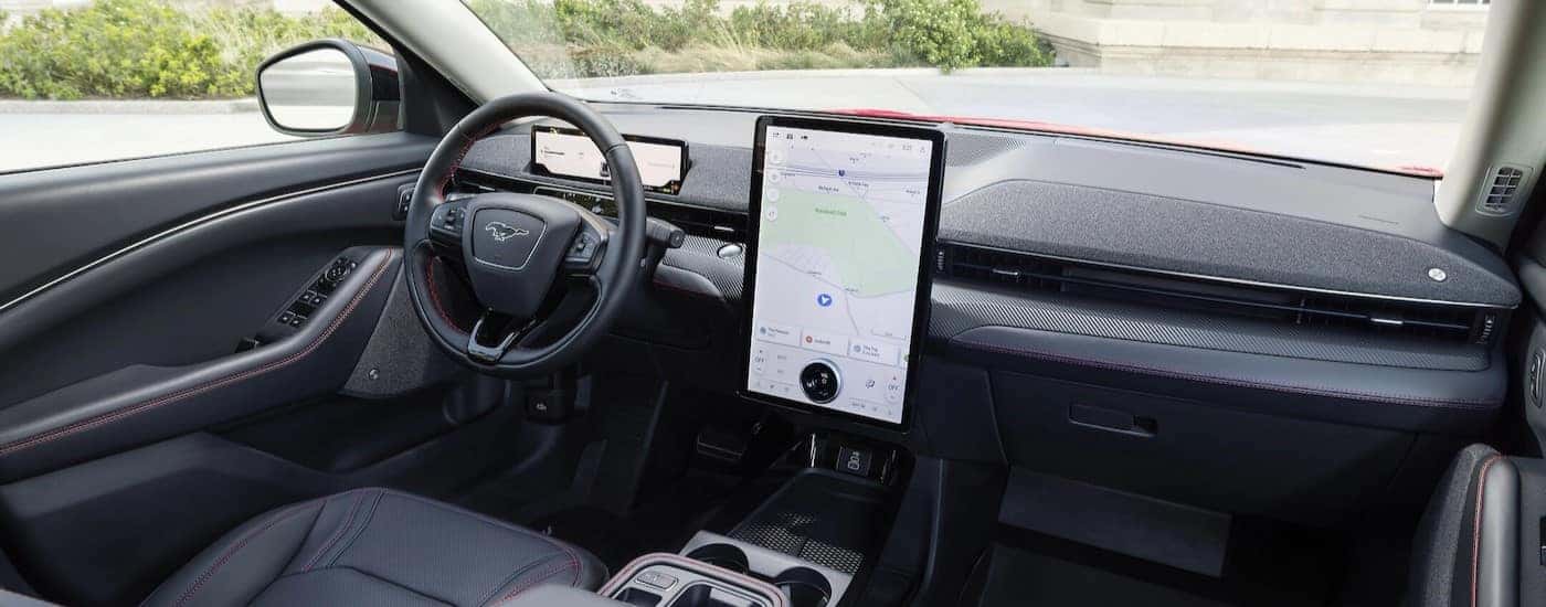 The black interior and dash are shown in a 2025 Mustang Mach-E for sale In Zionsville.