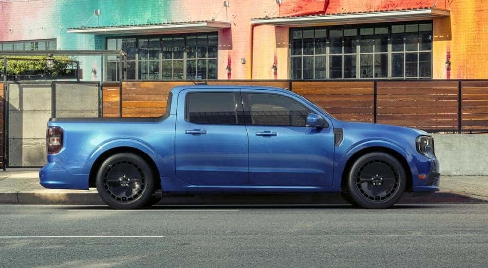A blue 2025 Ford Maverick Lobo parked on a city street.