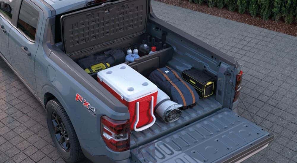 Gear stored in the bed of a blue 2025 Ford Maverick FX4.