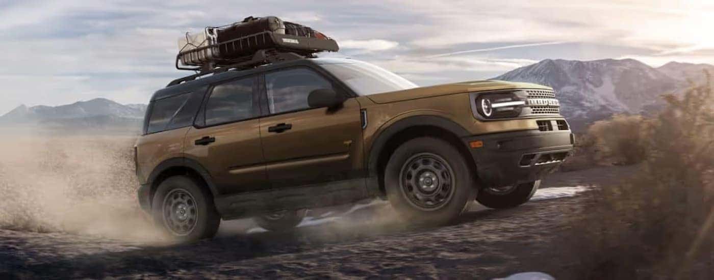 A gold 2022 Ford Bronco Sport off-roading.