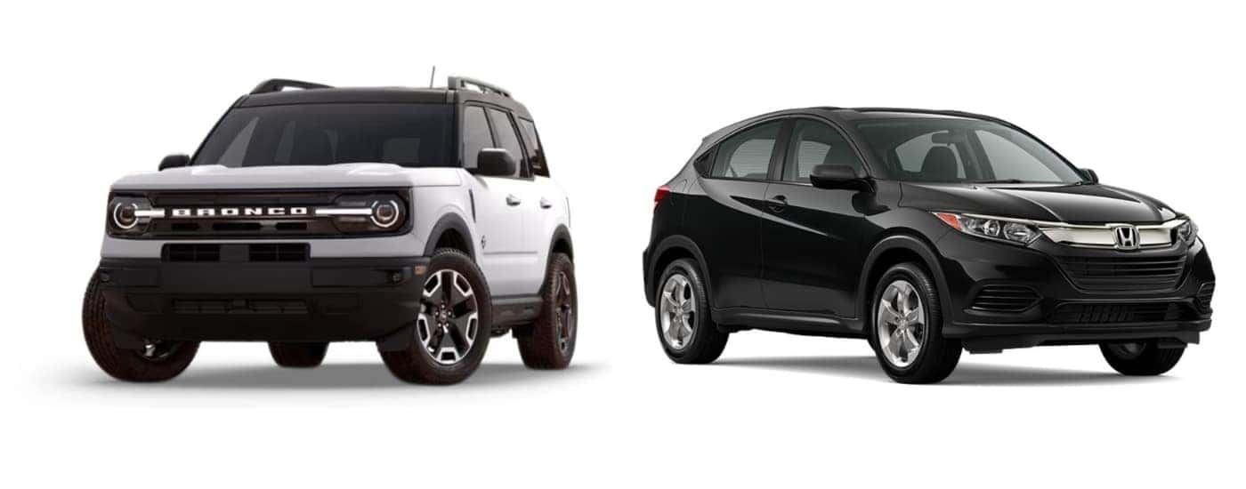 A white 2022 Ford Bronco Sport angled left and a black 2022 Honda HR-V angled right.