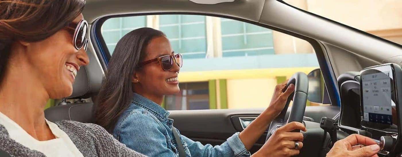 Two people driving in a 2022 Ford EcoSport.