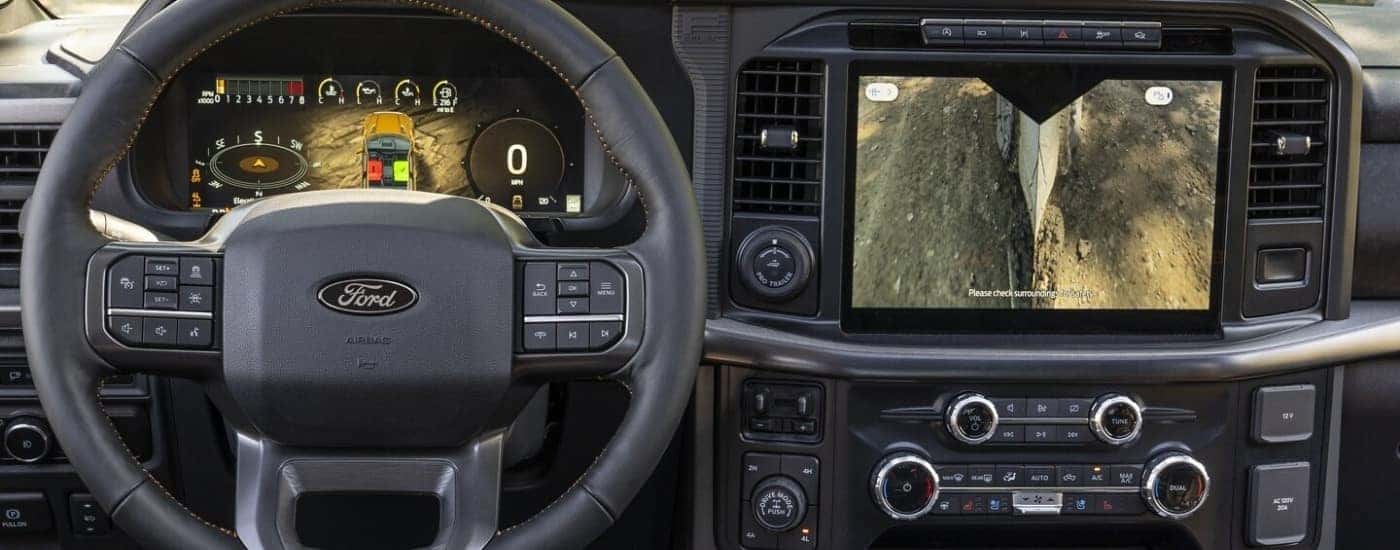 Steering wheel and infotainment screen in a 2025 Ford F-150 for sale near Noblesville.