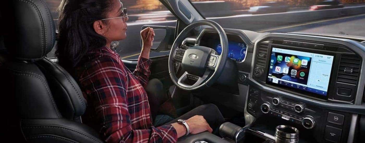 A person is shown using Blue Cruise in a 2023 Ford F-150 Limited.