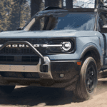 Blue 2026 Ford Bronco Sport Outer Banks for sale near Noblesville driving on a trail