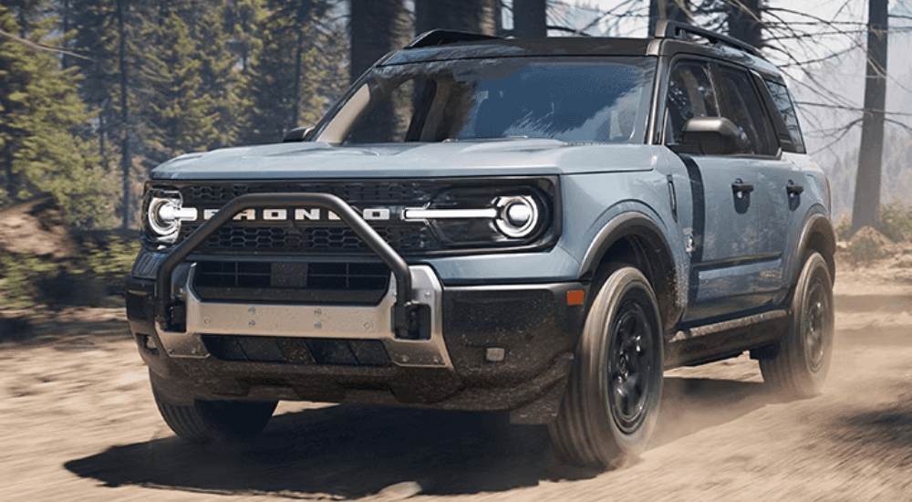 Blue 2026 Ford Bronco Sport Outer Banks for sale near Noblesville driving on a trail