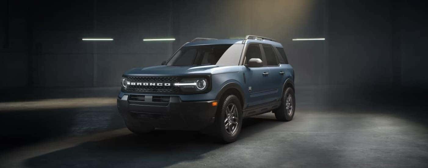 A blue 2026 Ford Bronco Sport parked in a dark garage.