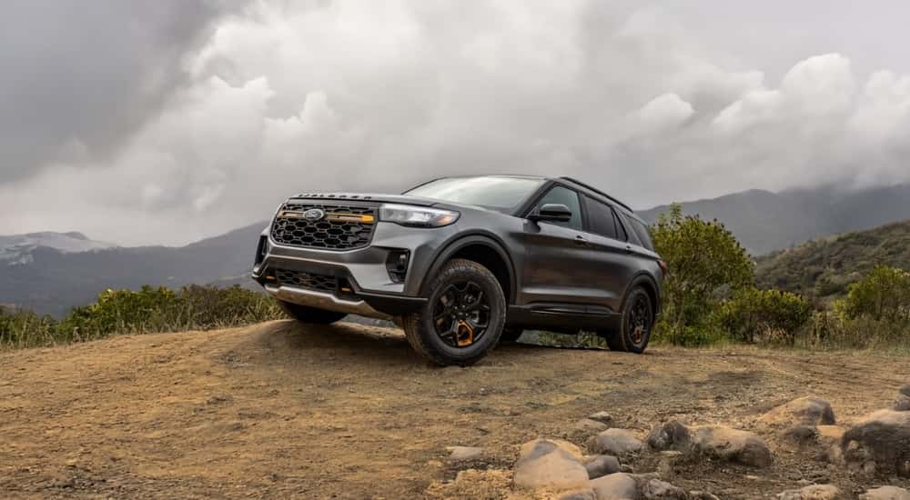 Silver 2026 Ford Explorer Tremor driving up a trail