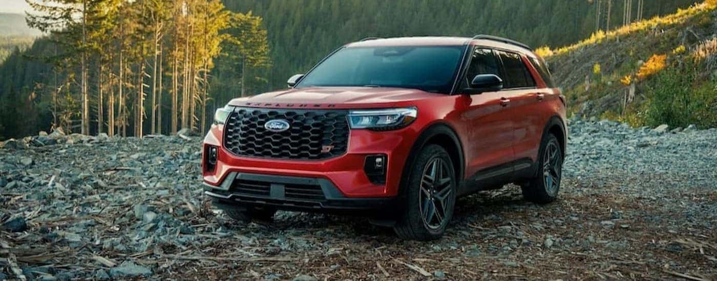 A red 2026 Ford Explorer ST parked off-road.