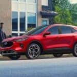 Red 2026 Ford Escape parked by a curb.