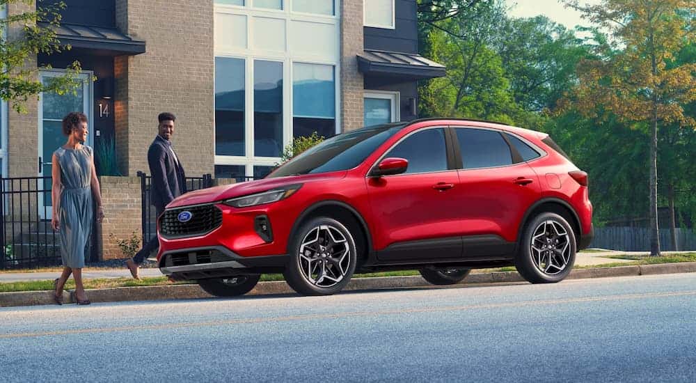 Red 2026 Ford Escape parked by a curb.