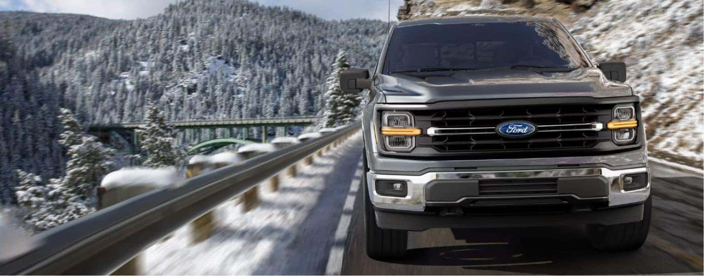 A gray 2026 Ford F-150 front-view driving.