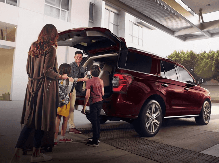 Family packing their Ford Explorer for Vacation