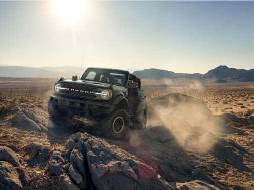 2024 Ford Bronco offroading over rocky terrain