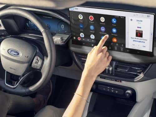 2024 Ford Escape view of woman's hand touching touchscreen display