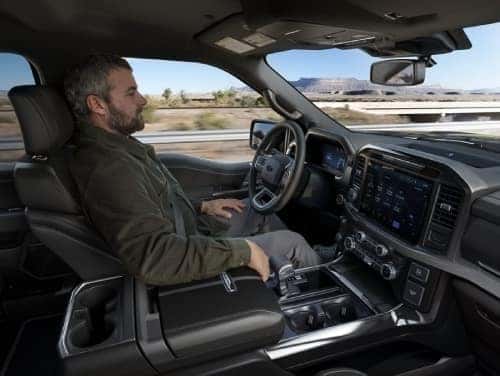 2025 Ford F-150 view of man in driver's seat with hands off the wheel