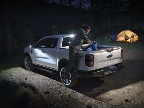 2025 Ford Ranger view of woman getting things out of bed at night with zone lighting on