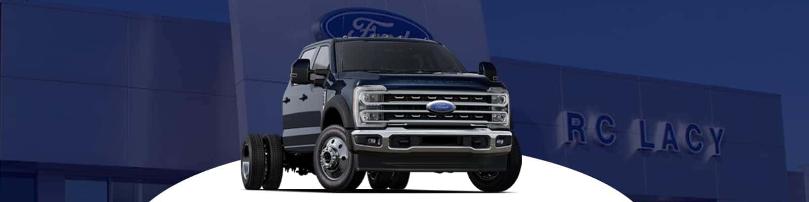 Payload and GVWR Reality Check: Ford F-450 vs. Ford F-550 Ford F-450 vs. Ford F-550 payload comparisons are really GVWR calculations. Payload is calculated by subtracting curb weight, passengers, cargo, upfit weight, fuel, accessories, and tongue weight from the Gross Vehicle Weight Rating, or GVWR. The most accurate reference for determining payload is the specific payload label located on the truck's door jamb. In the market, the Ford F-550 chassis cab is often chosen when buyers need more GVWR headroom for commercial bodies and equipment. The Ford F-450 remains an excellent choice when towing is the priority and payload needs are substantial but not dominated by a heavy upfit, and staying within ratings matters for braking, tire loading, and liability. Towing Focus and Why the Numbers Can Surprise People Some buyers are surprised to find that the Ford F-450 can outperform the Ford F-550 in towing capacity under certain configurations. This Ford F-450 vs. Ford F-550 discrepancy arises because towing capability is influenced by several factors, including GCWR, hitch design, axle ratio, cooling systems, and wheel and tire configurations. It's not solely determined by selecting the truck with the higher GVWR. For those who frequently tow trailers, the Ford F-450 is often a better option for pickup-style towing. In contrast, many Ford F-550 models are designed with a focus on payload, body installation, and specialized vocational equipment, which can result in a design that prioritizes different features over a singular towing statistic. Category winner: Ford F-450 — For buyers centered on trailer work, pickup-oriented towing configurations often make the Ford F-450 the clearer tool. Conventional vs. Gooseneck/5th-Wheel: What to Compare Conventional towing and gooseneck towing should never be treated as the same use case. Hitch type changes stability, load transfer, and rating limits, and high trailer ratings can still be constrained by bed payload or pin weight. Use the current Ford towing guide and confirm labels on the exact truck. In Ford F-450 vs. Ford F-550 comparisons, the trailer should match the truck’s exact configuration rather than the largest number in a brochure. Work-Ready Use Cases and Upfit Compatibility Landscaping, construction, farming, towing services, and municipal fleet operations do not ask the same thing from a Ford F-450 vs. Ford F-550 truck. The Ford F-550 usually fits jobs that need a utility body, stake body, dump body, flatbed, or PTO-related commercial setup, while the Ford F-450 often fits buyers who want serious capability in a less specialized package. Ford Pro support also matters for commercial planning because ordering, telematics availability, and upfit coordination can influence downtime and deployment. For fleet managers, the Ford F-450 vs. Ford F-550 truck that enters service more quickly and carries the legally required body is often the more profitable choice. Category winner: Ford F-550 — When the truck must carry a vocational body and equipment every day, the Ford F-550 usually offers a stronger foundation. Common Upfits That Push Buyers Toward Ford F-550 Service bodies with compressors or generators, dump bodies, heavier flatbeds with tool storage, and some utility crane applications commonly push buyers toward the Ford F-550 vs. F-450. Higher GVWR headroom can preserve usable payload after the body is installed, which is the metric that determines whether the truck stays useful. Common Scenarios Where the Ford F-450 Makes Sense The Ford F-450 makes sense for frequent towing in a pickup-style setup, mixed personal and work driving, and buyers who do not need the higher chassis-cab path. The final choice between the Ford F-450 vs. Ford F-550 should still come from the exact payload label and equipment plan, not assumptions based on model name alone. Ownership Considerations That Affect Total Cost The operating costs of a Ford F-450 vs. Ford F-550 are influenced more by its load profile than by its brand or model prestige. Key factors like tires, brakes, fuel consumption, diesel exhaust fluid (DEF) for diesel engines, and routine and body maintenance are all affected by the vehicle's weight, duty cycle, and how frequently it operates close to its maximum capacity. Additionally, insurance premiums, registration fees, and compliance requirements may vary based on the Ford F-450 vs. Ford F-550 Gross Vehicle Weight Rating (GVWR) classification and the intended business usage. When deciding between models such as the Ford F-450 and Ford F-550, making an informed choice early on is essential. It can help minimize the risk of overloading, reduce the likelihood of premature wear and unscheduled repairs, and ultimately lead to less downtime. Category winner: Ford F-450 — For many non-fleet buyers, the Ford F-450 can be easier to live with when the job does not require a heavier commercial-body strategy. Compliance and Weight-Class Considerations (State-Dependent) A Ford F-450 vs. Ford F-550 fleet buyer should check local rules for commercial plates, inspections, DOT requirements, and weight-class triggers before ordering. That step is operational planning, not legal advice, but it can change the total cost and administrative burden of a truck. About the Ford F-450 The Ford F-450 stands out in this comparison as a vehicle primarily designed for towing, attracting those who seek substantial capability without diving into a heavier chassis-cab option. It strikes a perfect balance for buyers who require strong towing performance while still prioritizing the versatility of a pickup and ease of maneuvering. About the Ford F-550 The Ford F-550 is typically the commercial-body platform in the Ford F-450 vs. Ford F-550 matchup. It is commonly selected when payload after upfit, frame flexibility, and higher GVWR classes matter more than having a factory pickup bed. Decision Framework: When to Choose Ford F-450 vs. When to Choose Ford F-550 Choose Ford F-450 if: You need frequent heavy towing in a pickup-oriented configuration. You want strong capability without maximum chassis-cab GVWR headroom for a heavy upfit. Your work includes personal driving, jobsite towing, and tighter-route maneuvering. Your crew and equipment plan still fits the truck’s payload label. You want to bring your trailer plan to our team for label-based matching. Choose Ford F-550 if: Your build includes a service body, dump body, utility body, or flatbed that will consume a significant payload. You need higher GVWR classes commonly used in commercial service. You need wheelbase and frame flexibility for upfitting. Your operation depends on carrying tools, equipment, and crew every day. You want us to review the upfit plan before finalizing the order. Experience Ford Truck Toughness For upfit-driven commercial builds, the Ford F-550 is usually the more appropriate recommendation. For tow-driven pickup builds, the Ford F-450 is often the cleaner answer, but the outcome depends on the configuration. The right process is simple: start with the payload after upfit, confirm the trailer type, then evaluate the cab, wheelbase, and operating costs. That sequence keeps Ford F-450 vs. Ford F-550 decisions grounded in work requirements instead of assumptions. At DEALERSHIP, our team can help compare build sheets, GVWR labels, and upfit plans before you commit. Visit us to review current Ford Super Duty options, custom ordering paths, and practical commercial-truck guidance. How Our Team Helps You Confirm the Right Build We can review the door-jamb label, axle ratings, and upfit weight estimates so the final truck matches the real job. We also help with custom ordering and commercial-truck planning based on actual work requirements, not generic ratings. FAQs Fast Answers for Common Comparison Questions What is the weight difference between the Ford F-450 and the Ford F-550? It depends on cab, drivetrain, body style, and GVWR class. A Ford F-550 chassis cab is typically built in higher GVWR classes, but the exact difference should be confirmed on the build sheet and door-jamb label. Why can a Ford F-450 tow more than a Ford F-550? Tow ratings depend on GCWR, axle ratio, hitch type, wheel and tire setup, and engineering focus. Some Ford F-450 configurations are optimized for towing, while many Ford F-550 builds prioritize payload and upfits. How much weight can a Ford F-450 carry in the bed? Payload varies widely by configuration and equipment. The most reliable number is the payload figure on the specific truck’s door-jamb label. What are the pros and cons of buying a Ford F-450? Pros include strong towing-focused configurations and pickup-style usability for mixed work and personal driving. Limits can include less GVWR headroom for heavy commercial upfits compared with a Ford F-550 chassis cab. Is a Ford F-550 always the right choice for a higher payload? Often, but not automatically. Final usable payload depends on the body installed, axle ratings, equipment weight, and the exact truck’s labels, so confirm the exact truck’s labels and towing guide.