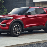 2024 Ford Explorer in red paint parked in a driveway.