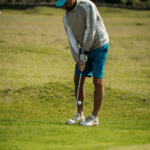 Man golfing at a Georgia course on a sunny day.