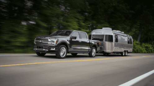 2024 Ford F-150 towing a camper trailer in Macon, GA.