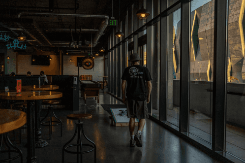 Man walking through a Macon, GA sports bar.