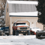 Ford Bronco parked in snowy road conditions.