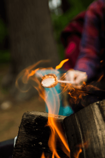Roasting marshmallow over a campfire in Macon, GA.