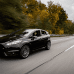 Black Ford Vehicle traveling down a highway in Georgia.