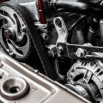 Closeup image of a Ford alternator needing repairs.