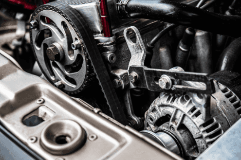Closeup image of a Ford alternator needing repairs.
