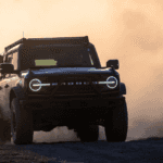 2025 Ford Bronco off-roading in sand dunes.