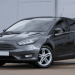 Grey Ford Focus Hatchback parked outside a Macon, GA service center.