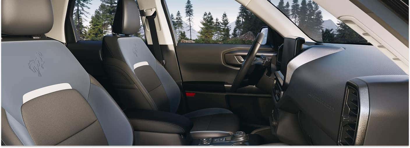 Interior of a 2026 Ford Bronco Sport featuring two-tone front seats and the dashboard.